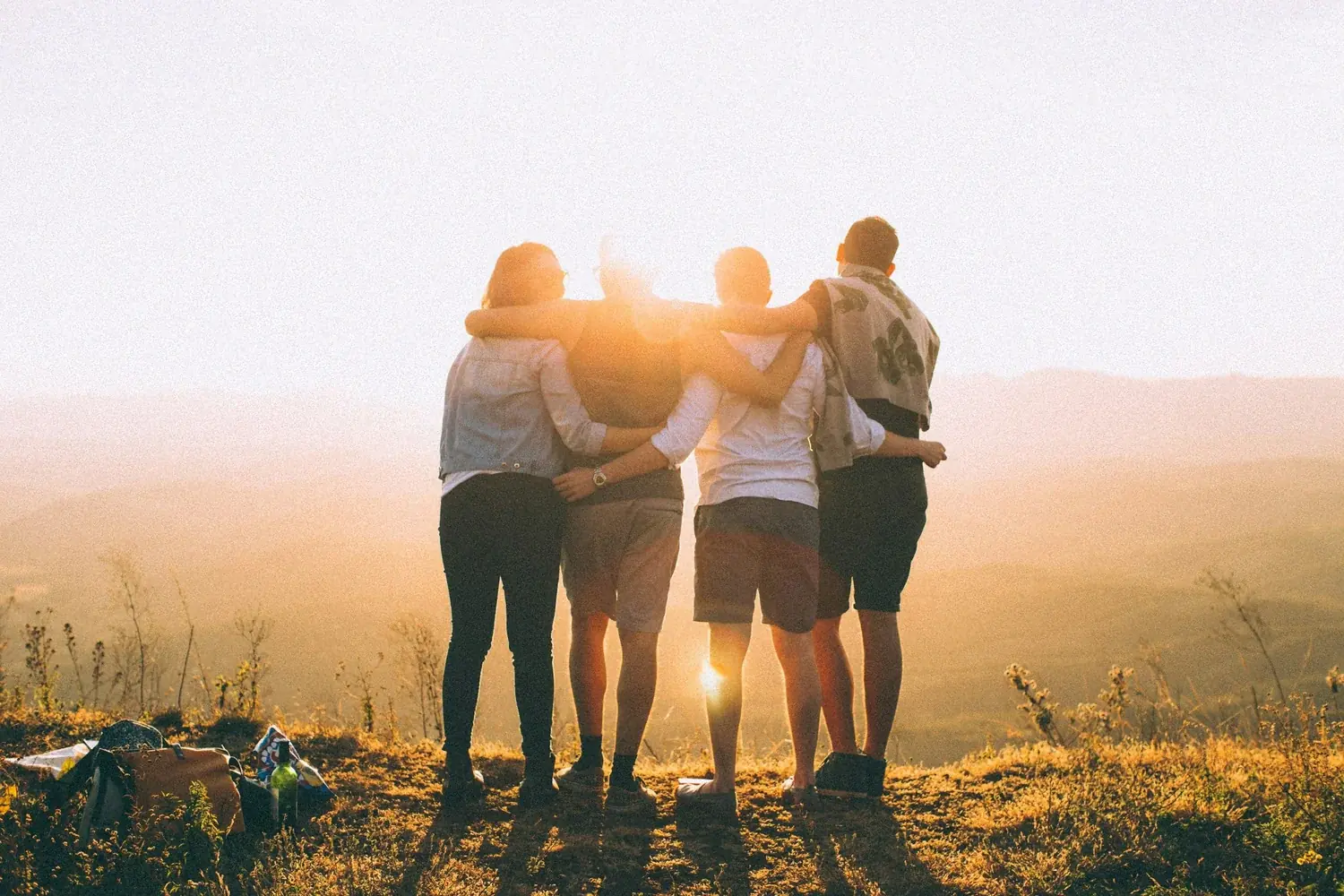Friends connecting around a campfire